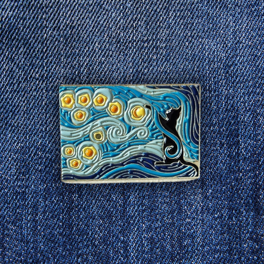 Pins Chat Nuit étoilée sur un jean