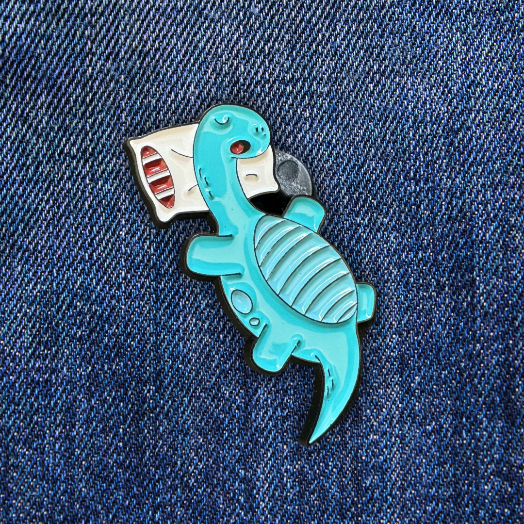 Pins Dinosaure Brachiosaure Endormi sur un jean